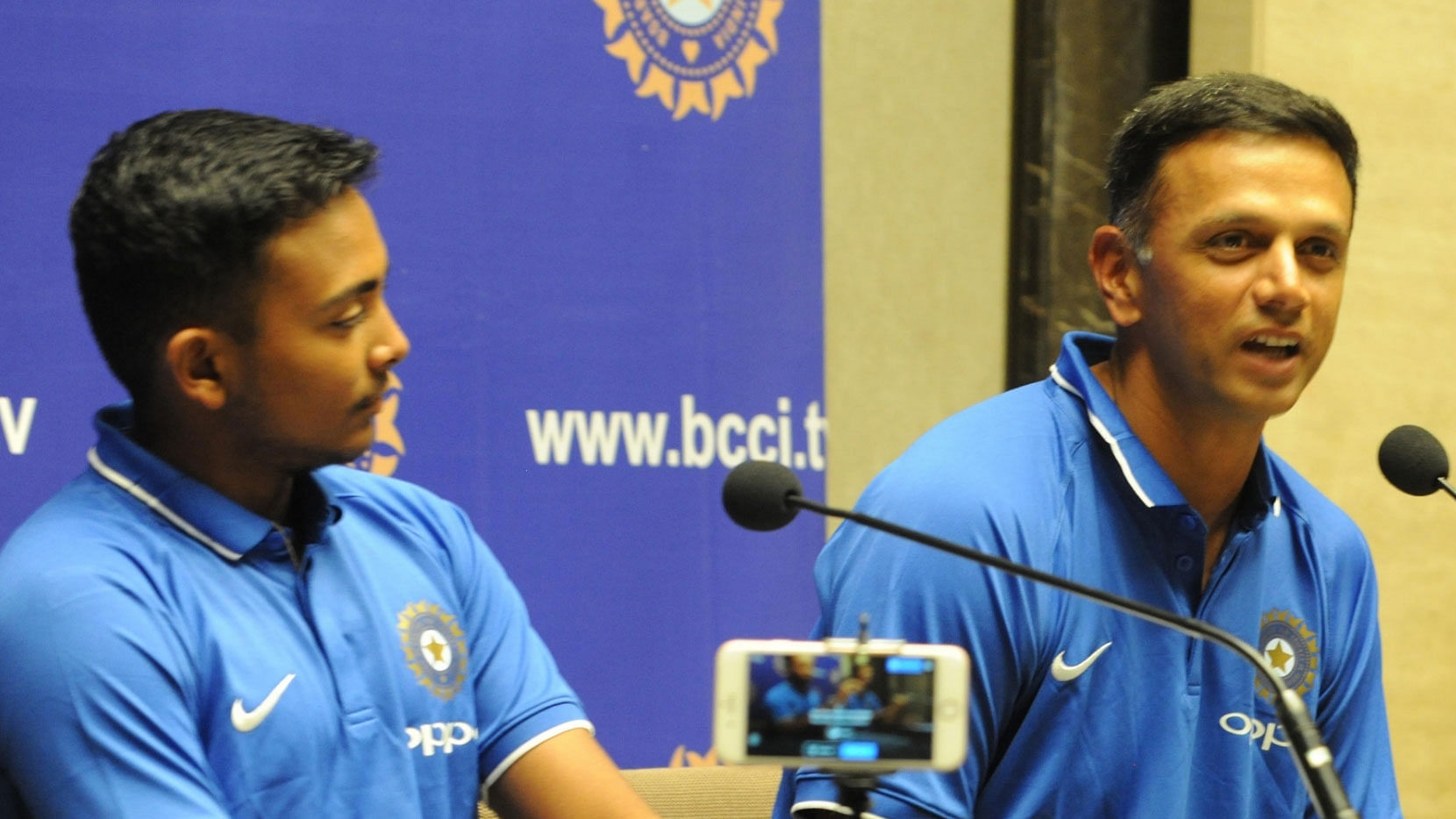 India U-19 coach Rahul Dravid and captain Prithvi Shaw address a press conference after their arrival in Mumbai.&nbsp;