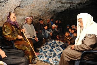 AFRIN, Feb. 8, 2018 (Xinhua) -- Syrian Kurdish people stay in a cave in a village in the countryside of the Kurdish-controlled enclave of Afrin, northern Syria, on Feb. 8, 2018. Civilians in the countryside of Afrin have been fleeing their areas to safer places since the Turkish-led military campaign started against Kurdish fighters in Afrin. (Xinhua/Ammar Safarjalani/IANS)