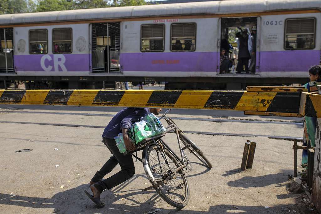 About ten commuters fall to death or are run over while crossing the tracks every day in Mumbai.