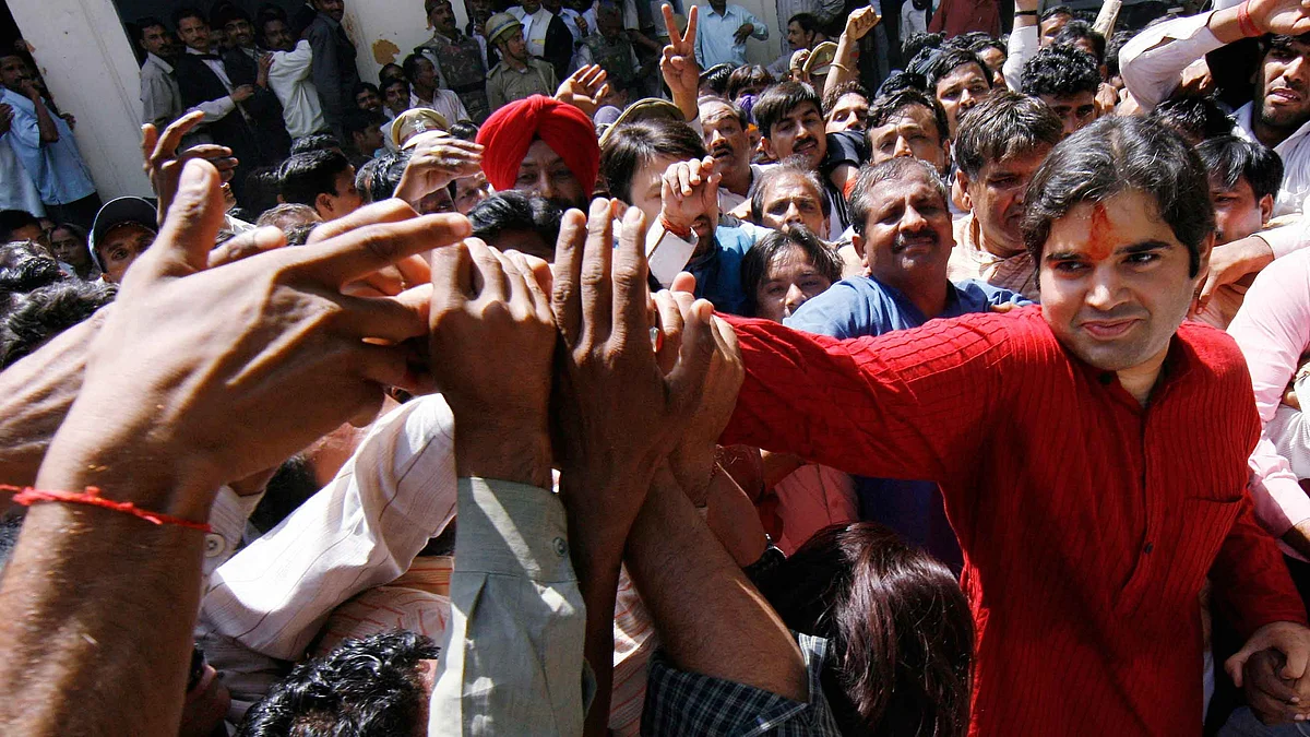 Varun Gandhi shakes hands with his supporters as he leaves a local court in Pilibhit, Uttar Pradesh, 28 March 2009.
