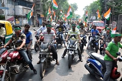 Kolkata: Trinamool Congress workers participate in a bike rally organised on Ram Navami in Kolkata, on March 25, 2018. (Photo: Kuntal Chakrabarty/IANS)