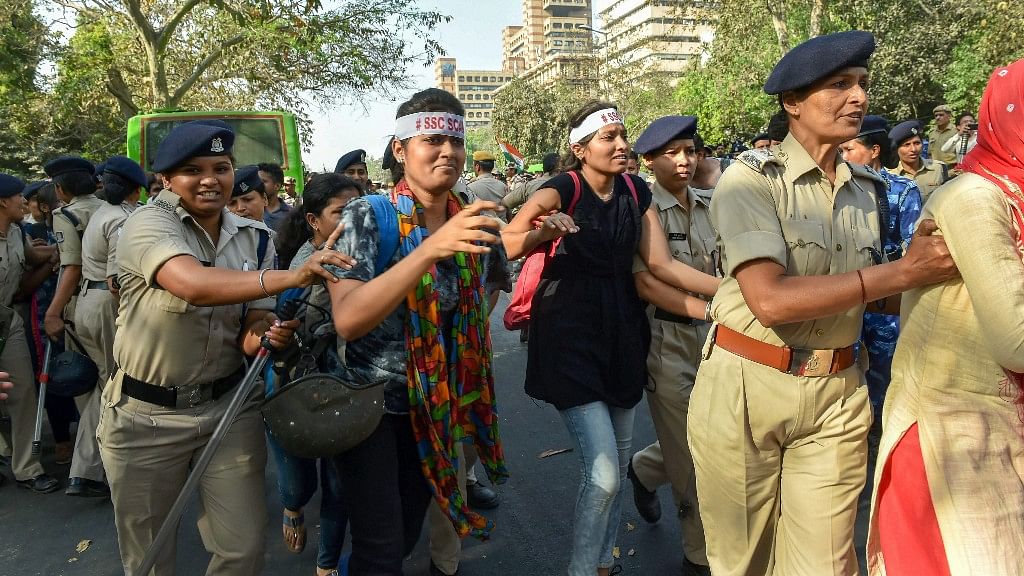Police detain students as they march from Jantar Mantar to Janpath during their Yuva Halla Bol protest over SSC scam, in New Delhi.
