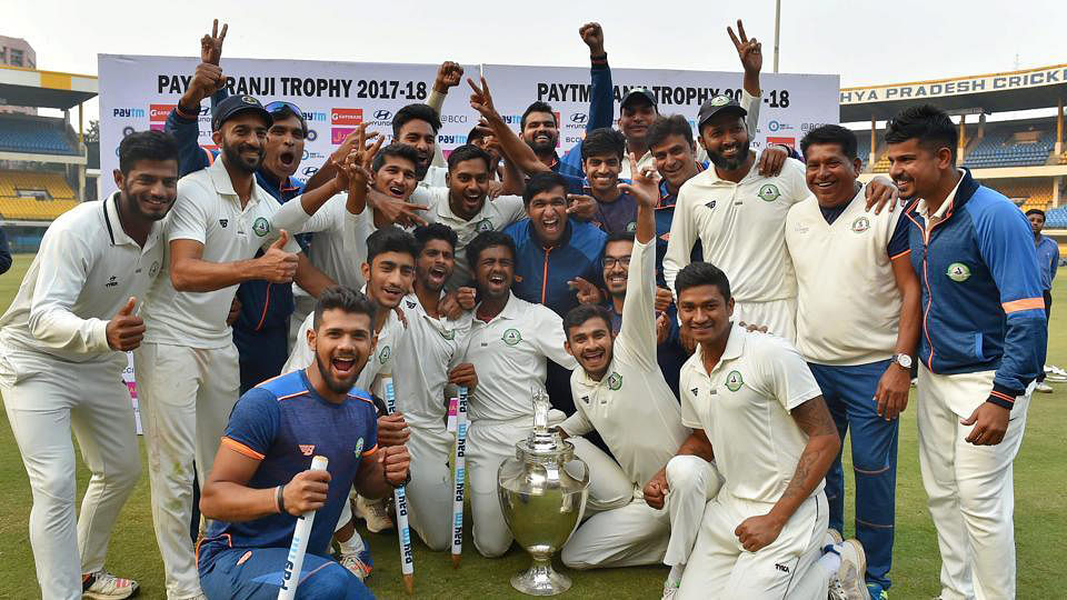 The jubilant Vidarbha team with the Ranji Trophy.