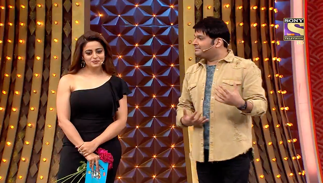 Neha Pendse has to just stand there and bear it.
