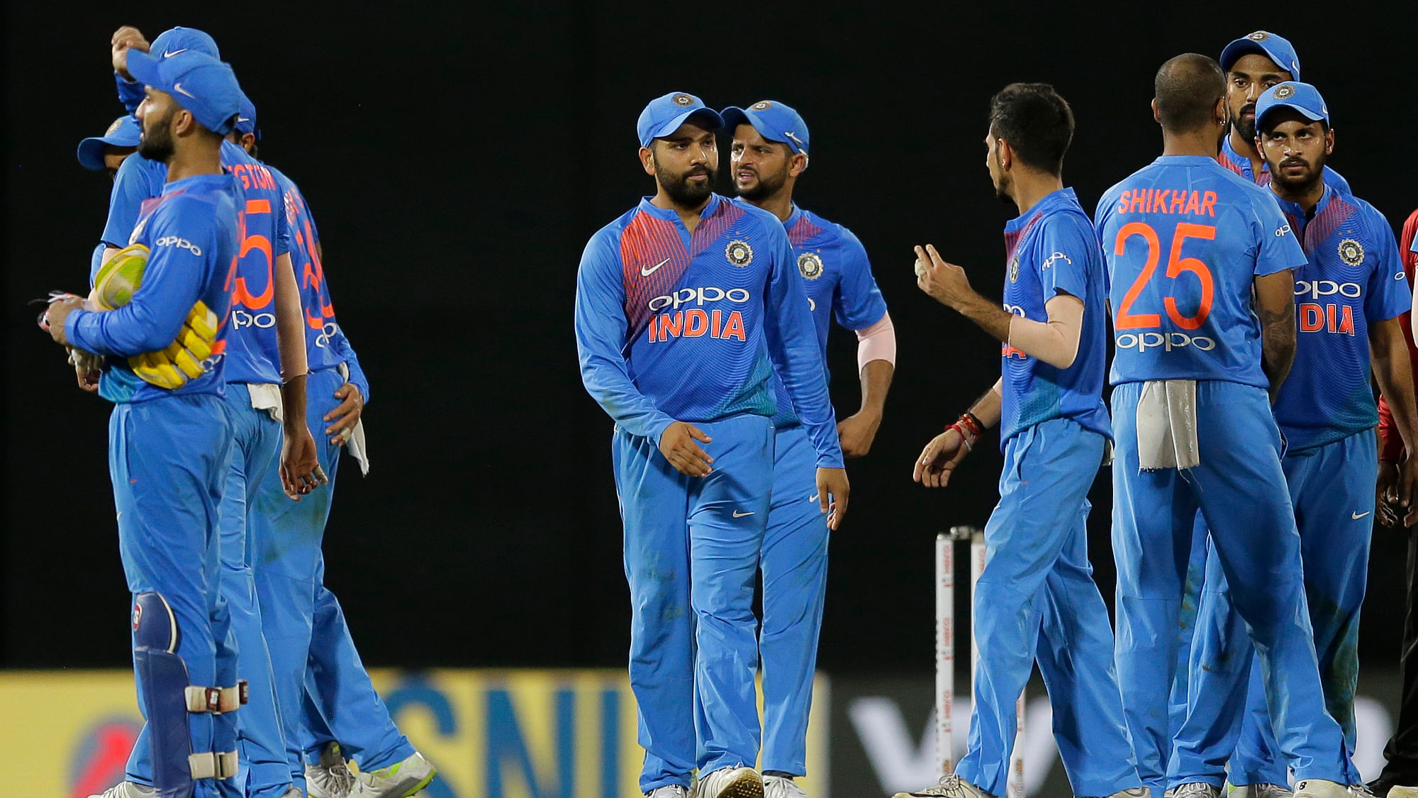 India’s Rohit Sharma, center, leads his team after defeating Bangladesh by 17 runs in their second Twenty20 cricket match in Nidahas triangular series in Colombo, Sri Lanka, Wednesday