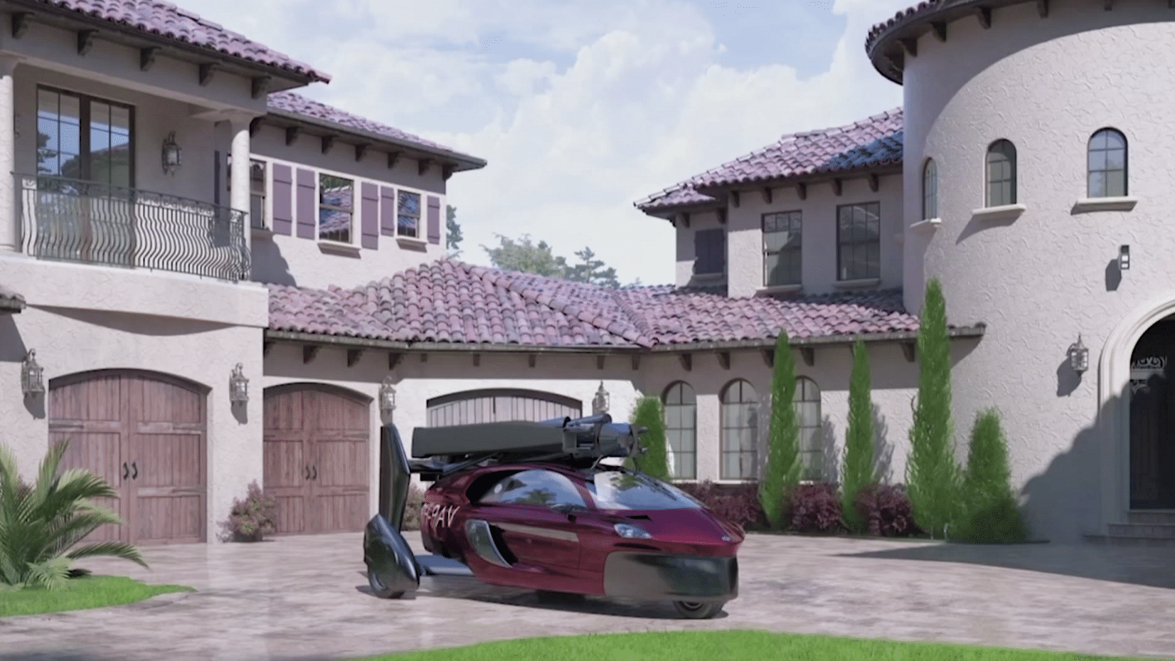 PAL-V, the car that can fly, parked outside a house.