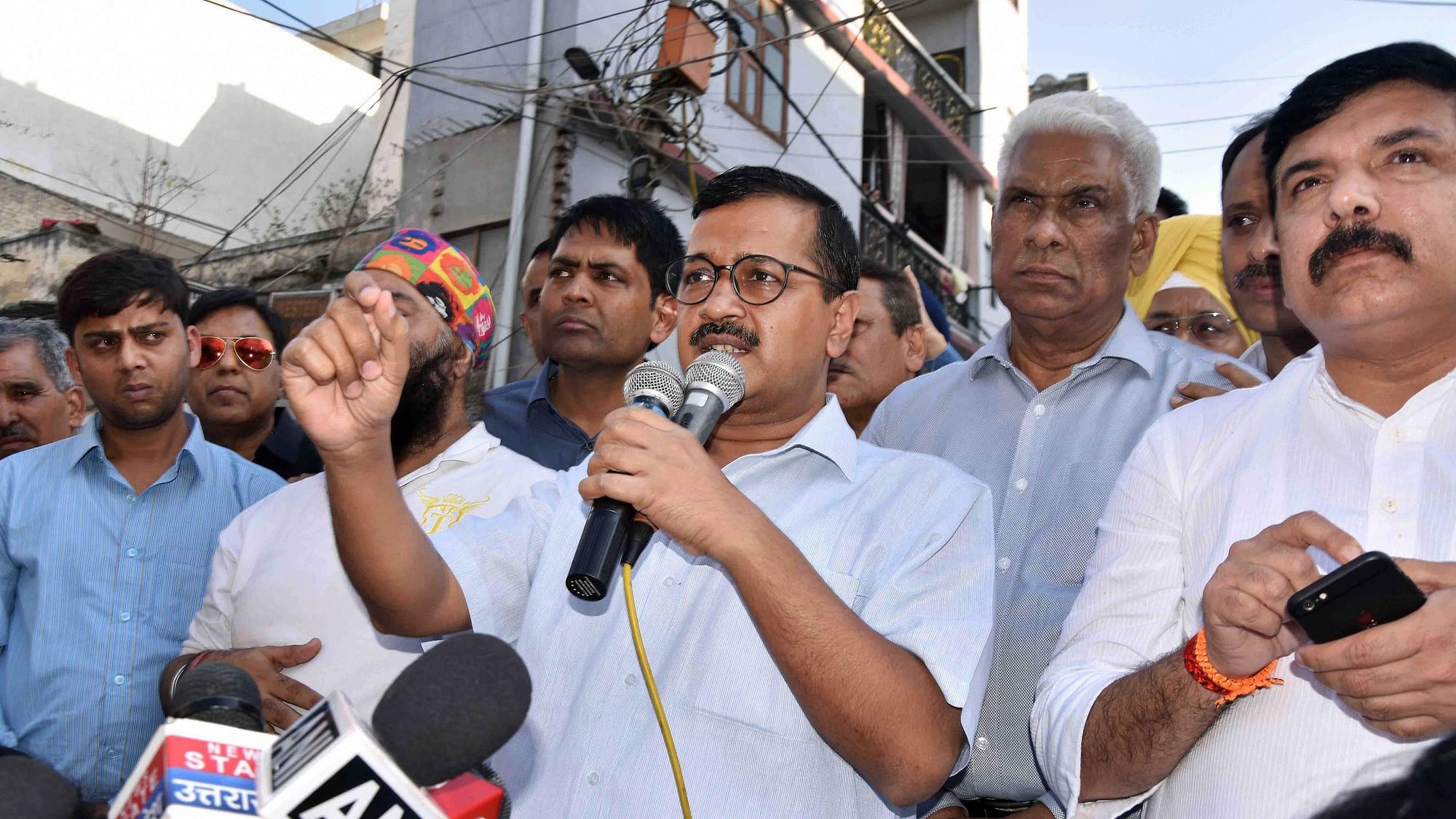 Arvind Kejriwal addresses traders in Delhi’s Amar Colony.