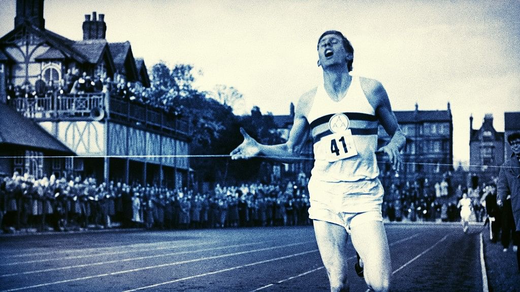 In this May 6, 1954, file photo, British athlete Roger Bannister breaks the tape to become the first man ever to break the four minute barrier in the mile at Iffly Field in Oxford, England.&nbsp;