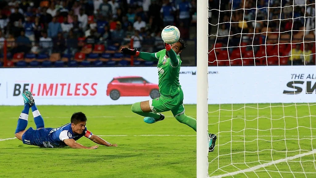 Sunil Chhetri of Bengaluru FC dives to score the opening goal against Chennaiyin FC in the ISL-4 final at Sree Kanteerava Stadium on Saturday