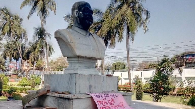 The statue of the Bharatiya Jana Sangh’s founder was blackened and a poster left near it.