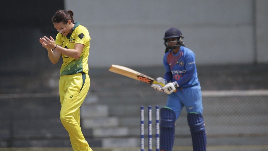 Australia’s Megan Schutt (left) celebrates after taking Mithali Raj’s wicket during their cricket match at the Women’s T20 Triangular Series in Mumbai.