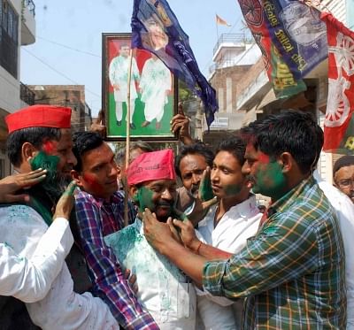 Allahabad: Samajwadi Party (SP) and Bahujan Samaj Party (BSP) workers greet each other, outside a counting center in Allahabad on March 14, 2018. SP on Wednesday took winning leads in both the Lok Sabha seats of Gorakhpur and Phulpur. With BSP backing its bitter rival SP, BJP appeared to be heading for a shock defeat. (Photo: IANS)