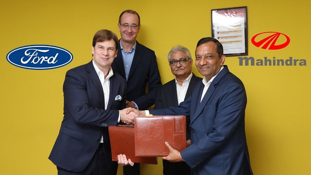 Jim Farley of Ford (extreme left) with Pawan Goenka of Mahindra (extreme right).&nbsp;