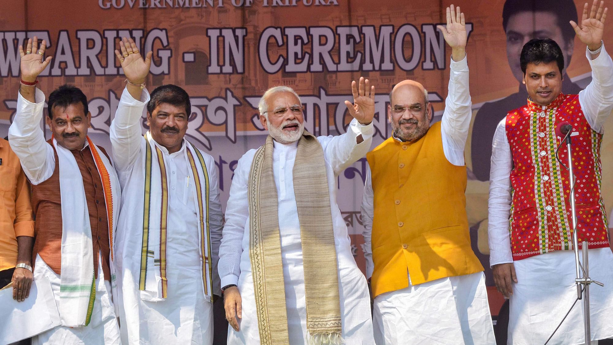 Prime Minister Narendra Modi with Bharatiya Janata Party (BJP) National President Amit Shah, new Tripura Chief Minister Biplab Kumar Deb and others during the swearing-in ceremony of the newly elected ministers , in Agartala on Friday.&nbsp;