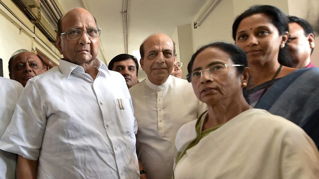 West Bengal Chief Minister and TMC head Mamata Banerjee with NCP chief Sharad Pawar after a meeting at Parliament House on Tuesday, 27 March.