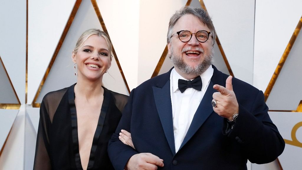 Director Guillermo del Toro and a guest at the 90th Academy Awards.