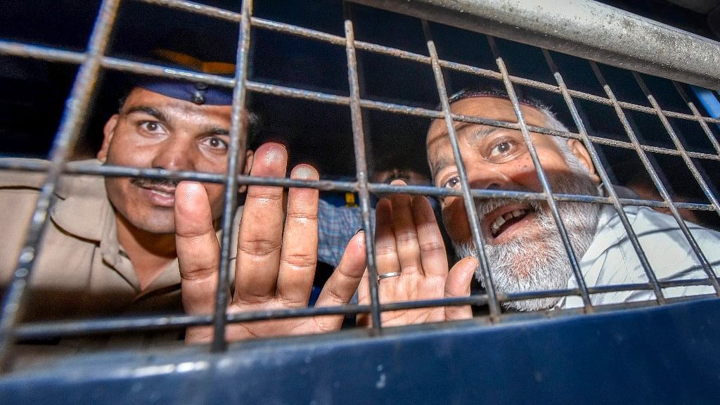 Yasin Mansoor Mohammed Farooq, alias Farooq Takla, a close aide to underworld don Dawood Ibrahim, being brought to St Georges Hospital for a medical examination before appearing at a court in Mumbai.