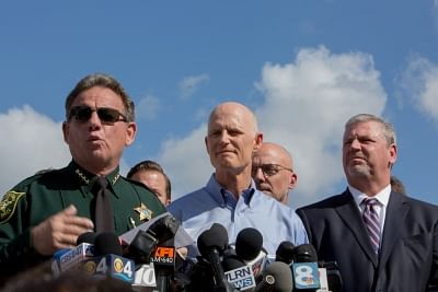 Florida Governor Rick Scott (C). (File Photo: Xinhua/Monica McGivern/IANS)