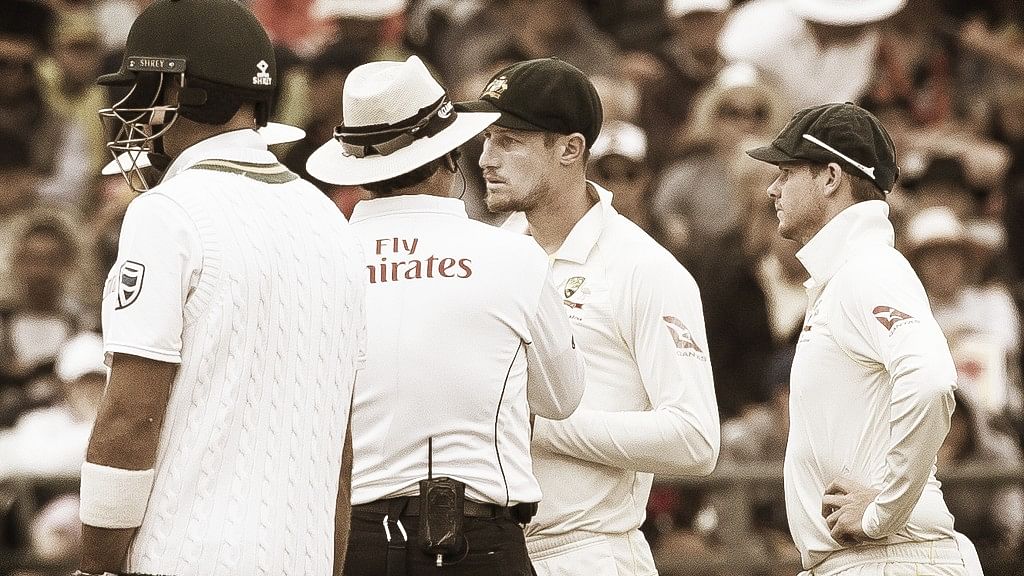 Cameron Bancroft of Australia is questioned by umpires over ball tampering on the third day of the third cricket test against South Africa at Newlands Stadium, in Cape Town.