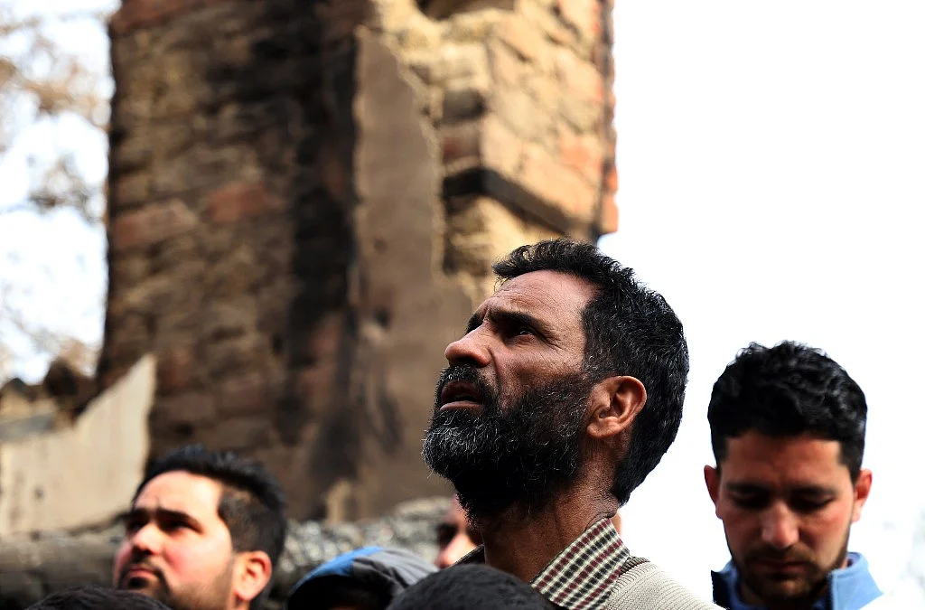 Ghulam looks at his house that he lost in the Khanmoh encounter. In the tussle between the militants and the Indian troops, he lost his ancestral home. 