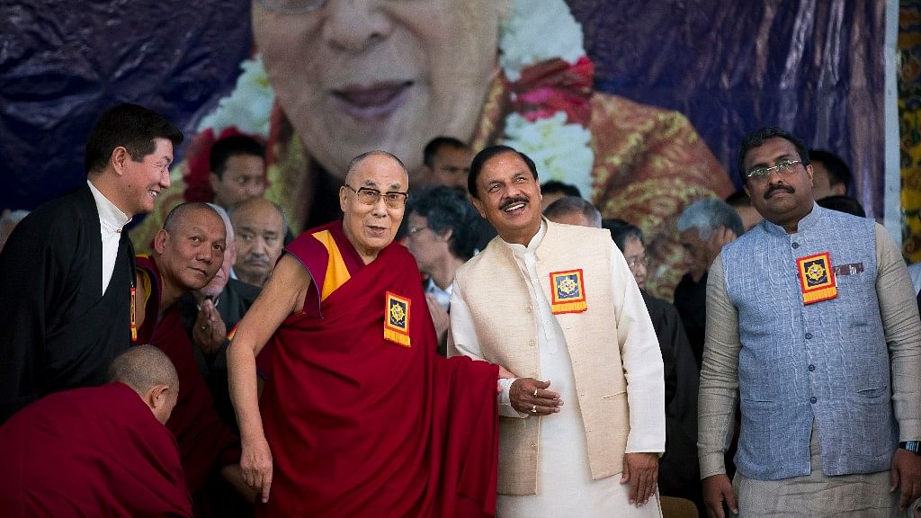 Tibetan spiritual leader the Dalai Lama holds hand with MoS Culture and Tourism Mahesh Sharma at an event marking the beginning of the 60th year of the spiritual leader’s exile in India, in Dharamsala, India, Saturday, 31 March 2018.&nbsp;