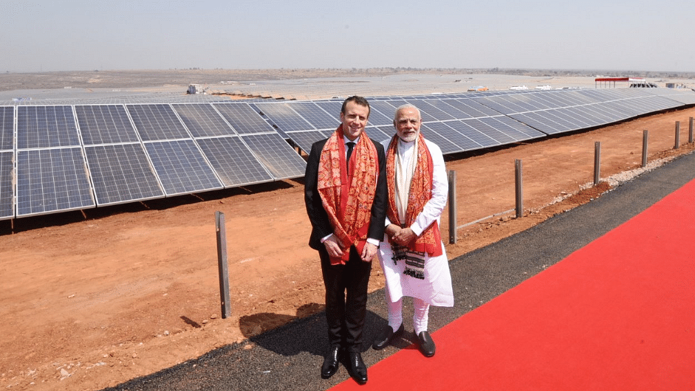 PM Narendra Modi and President of France Emmanuel Macron at the inauguration of Solar Power Plant at Mirzapur in Uttar Pradesh.