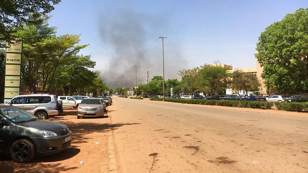 Smoke can be seen rising in the distance in central Ouagadougou, Burkina Faso, Friday 2 March 2018.&nbsp;
