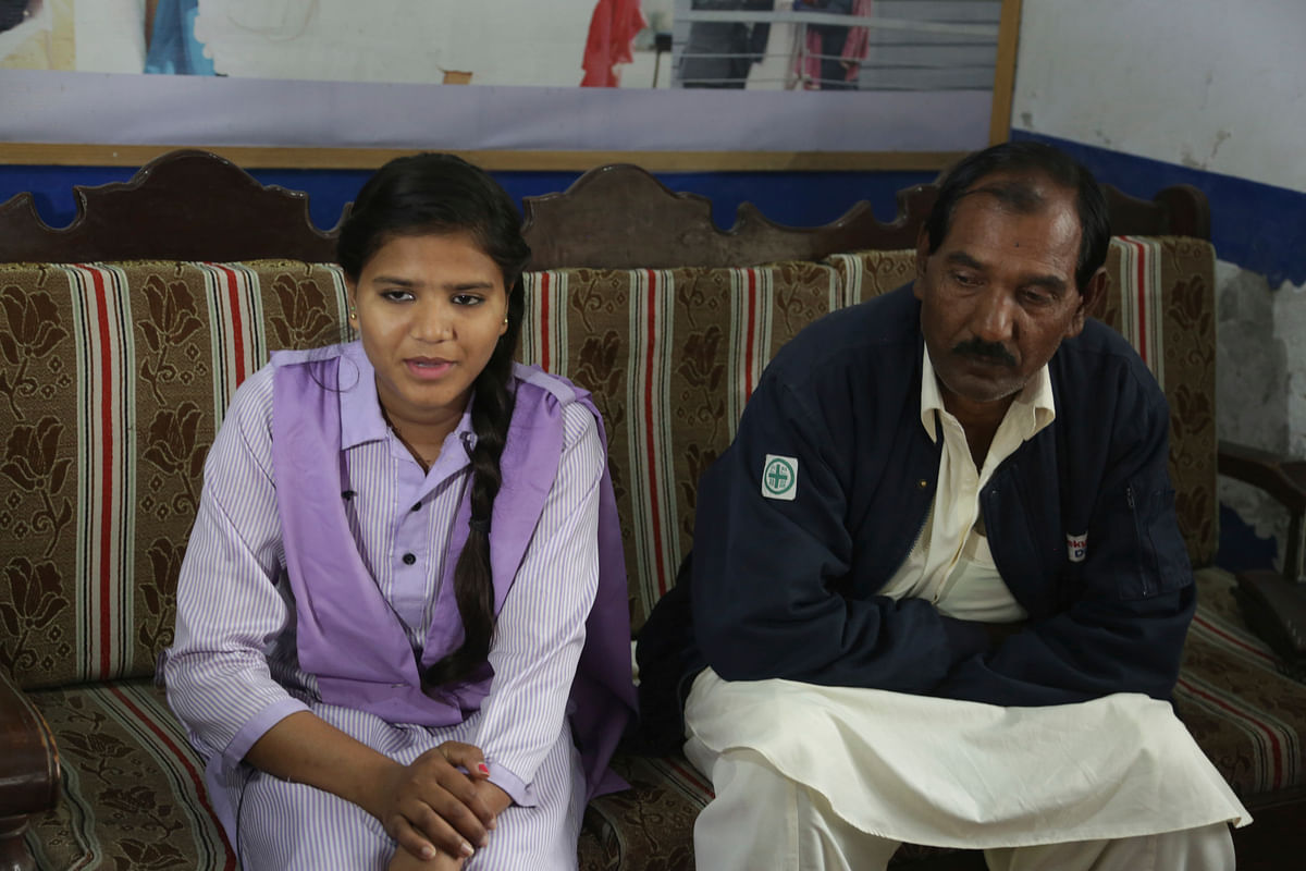 Ashiq Masih husband of a Pakistani Christian woman Aasia Bibi who is facing blasphemy charges, talks to the Associated Press with her daughter in Lahore, Pakistan.&nbsp;