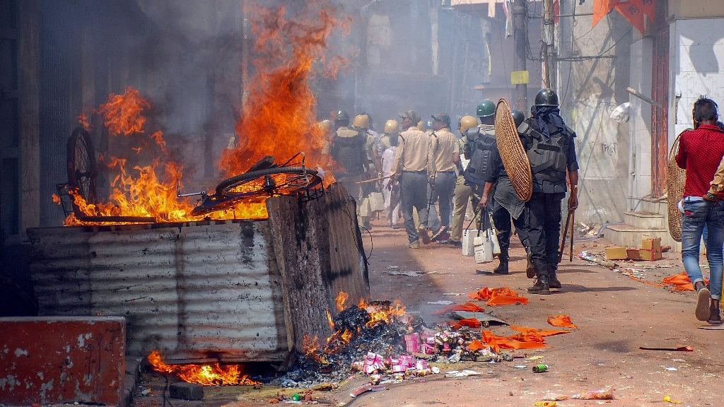 Police personnel patrol the area after a clashes and incidents of arson over Ram Navami procession at Raniganj in Burdwan district.