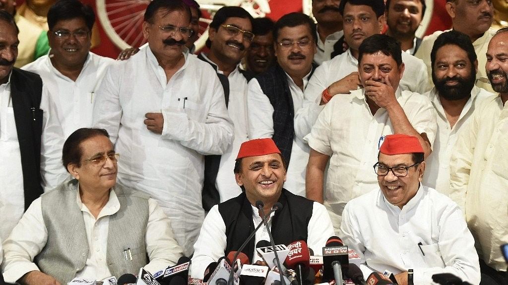 Samajwadi Party President Akhilesh Yadav (centre), with senior leaders Kiranmoy Nanda and Azam Khan, addresses a press conference after the by-election results, at the party headquarters in Lucknow on Wednesday 14 March 2018.