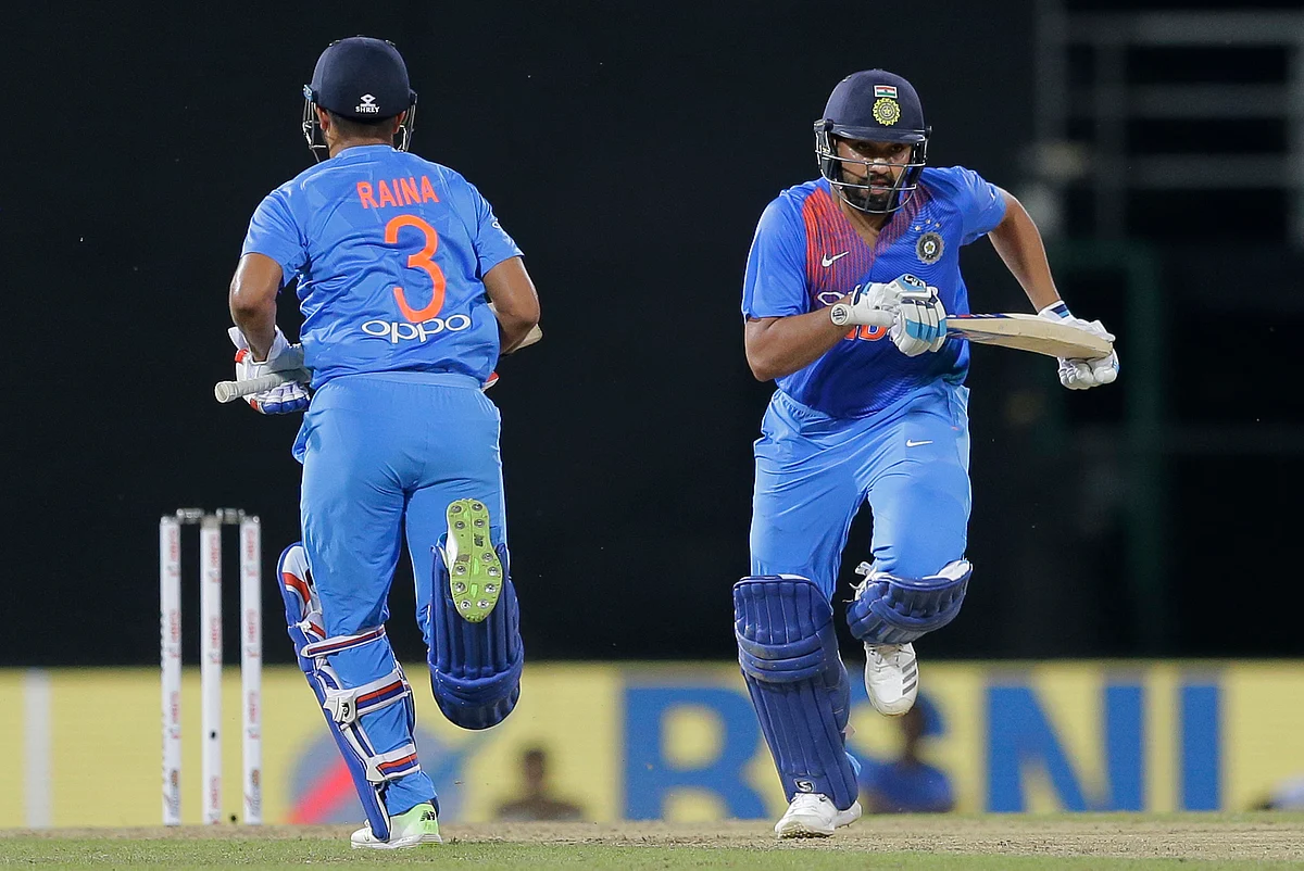 India’s Rohit Sharma, right, and Suresh Raina run between wickets against Bangladesh during their second Twenty20 cricket match in Nidahas triangular series in Colombo, Sri Lanka