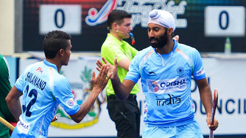Shilanand Lakra celebrates a goal with Talwinder Singh.