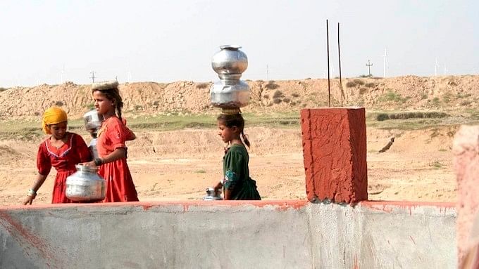 Young girls at a well in Gujarat facing  water scarcity