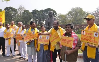 New Delhi: TDP MPs stage a demonstration to press for special economic status for Andhra Pradesh, at Parliament in New Delhi on March 22, 2018. (Photo: IANS)