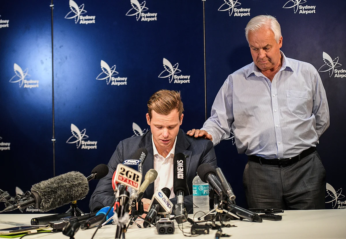 Steve Smith, left, with his father Peter Smith at the press conference in Sydney