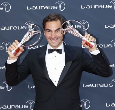MONACO, Feb. 28, 2018 (Xinhua) -- Swiss tennis player Roger Federer poses with the "Sportsman Award" and "Comeback Awards" at the 2018 Laureus World Sports Awards in Monaco, on Feb. 27, 2018. (Xinhua/Ye Pingfan/IANS)