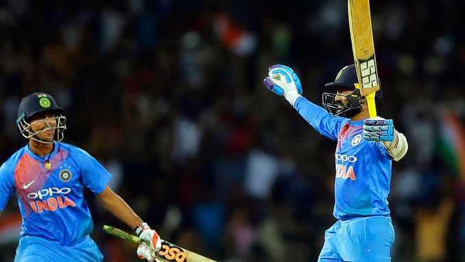 Dinesh Karthik celebrates after helping India defeat Bangladesh in the Nidahas Trophy T20 tri-series final.