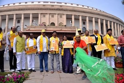 New Delhi: TDP MPs stage a demonstration to press for special economic status for Andhra Pradesh at Parliament in New Delhi on March 16, 2018. (Photo: IANS)