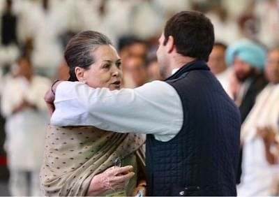 New Delhi: Congress President Rahul Gandhi shares a warm moment with her mother UPA Chairperson Sonia Gandhi during the 84th plenary session of Indian National Congress at Indira Gandhi Indoor Stadium in New Delhi on March 17, 2018. (Photo: IANS/Twitter/@INCIndia)