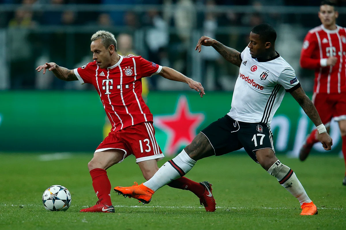 Bayern’s Rafinha, left, and Besiktas’ Jeremain Lens challenge for the ball during the Champions League, round of 16, second leg, soccer match between Besiktas and Bayern Munich at Vodafone Arena stadium in Istanbul, Wednesday, March 14, 2018. 