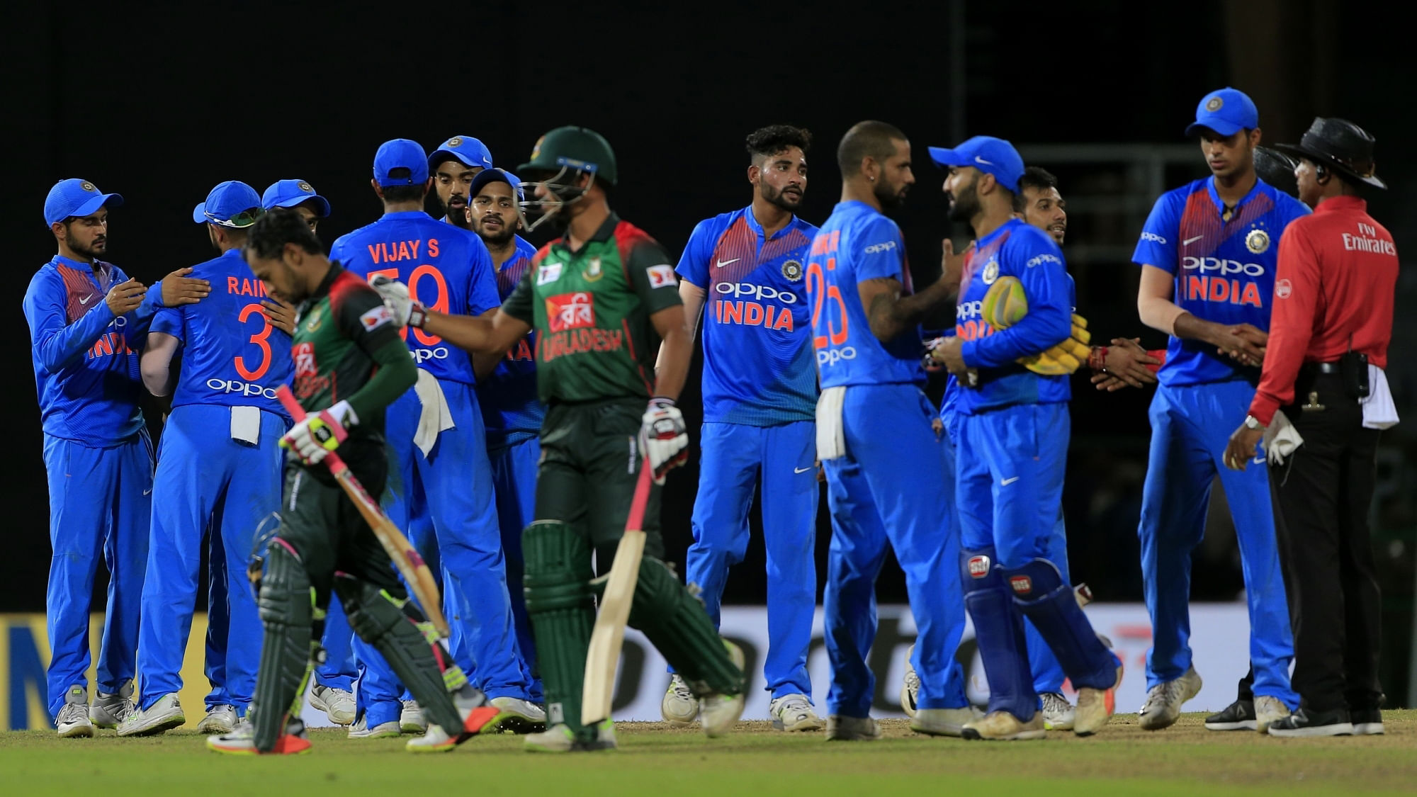 Players after the match following India’s 17-run win over Bangladesh.