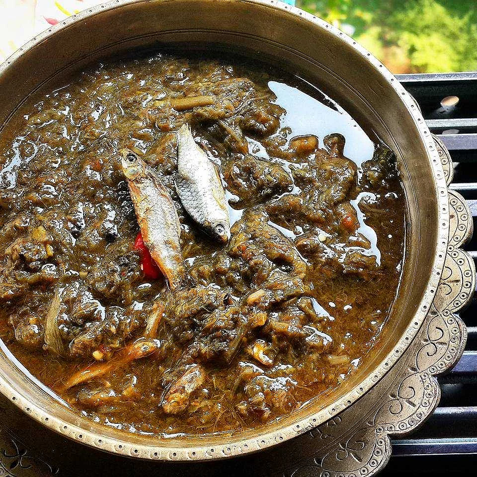 Kosuthuri Hukoti Maas (tender Colocasia leaves) cooked with smoked pond fishes.