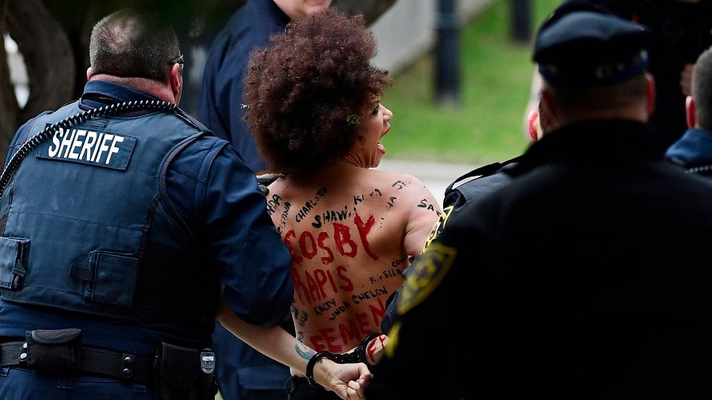 Actress Nicolle Rochelle, who appeared on several episodes of “The Cosby Show,” is detained after Bill Cosby arrives for his sexual assault trial at the Montgomery County Courthouse.