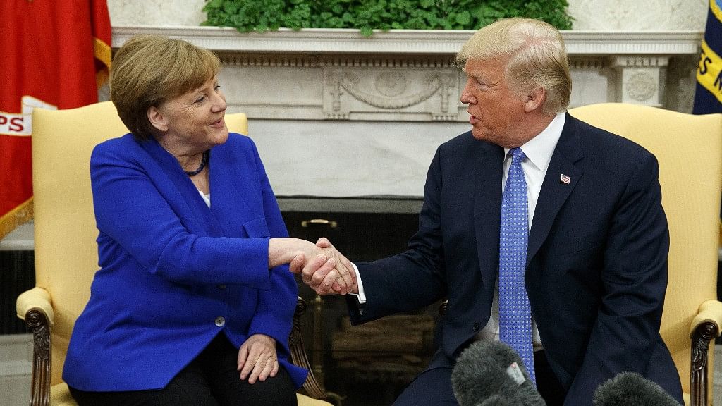 President Donald Trump meets with German Chancellor Angela Merkel in the Oval Office of the White House.