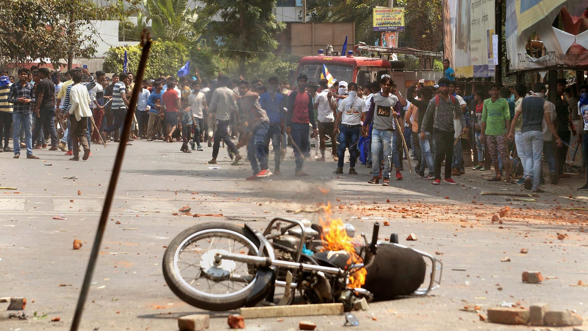  A bike set on fire by a group of protesters during Bharat Bandh call given by Dalit organisations against the alleged dilution of the SC/ST Act, in Meerut on 2 April 2018.