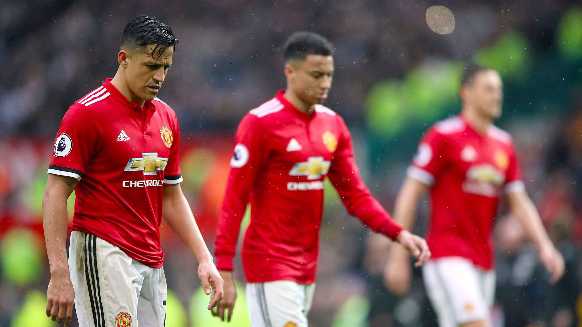 Manchester United’s Alexis Sanchez, left, leaves the pitch dejected after the final whistle during the English Premier League soccer match against West Bromwich Albion.