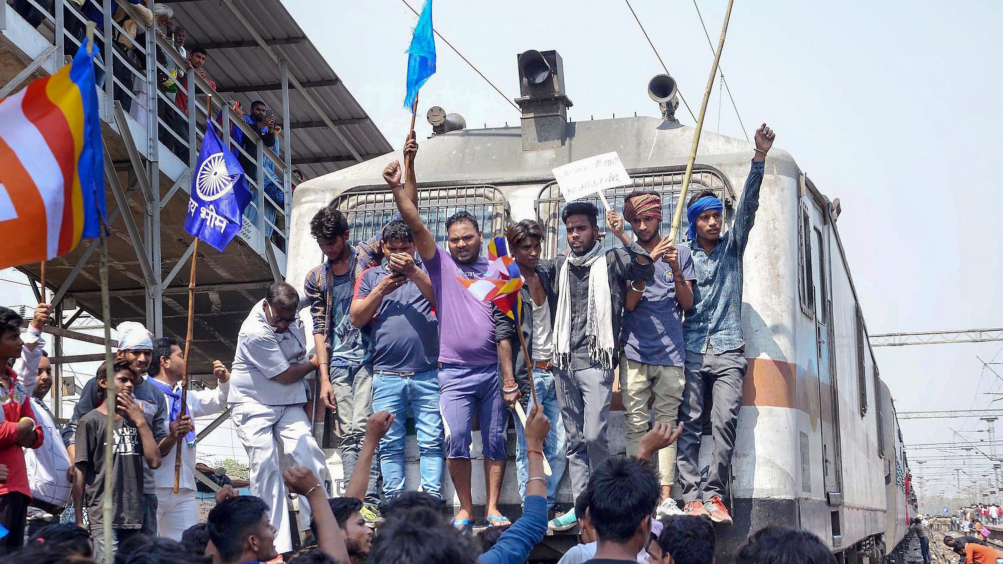 Members of the Dalit community stop a train in Mathura on 2 April during the Bharat Bandh.