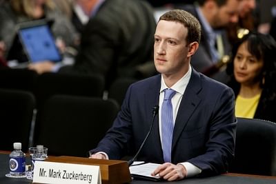 WASHINGTON, April 10, 2018 (Xinhua) -- Facebook CEO Mark Zuckerberg testifies at a joint hearing of the Senate Judiciary and Commerce committees on Capitol Hill in Washington D.C., United States, on April 10, 2018. Facebook CEO Mark Zuckerberg told Congress in written testimony on Monday that he is "responsible for" not preventing the social media platform from being used for harm, including fake news, foreign interference in elections and hate speech. (Xinhua/Ting Shen/IANS)