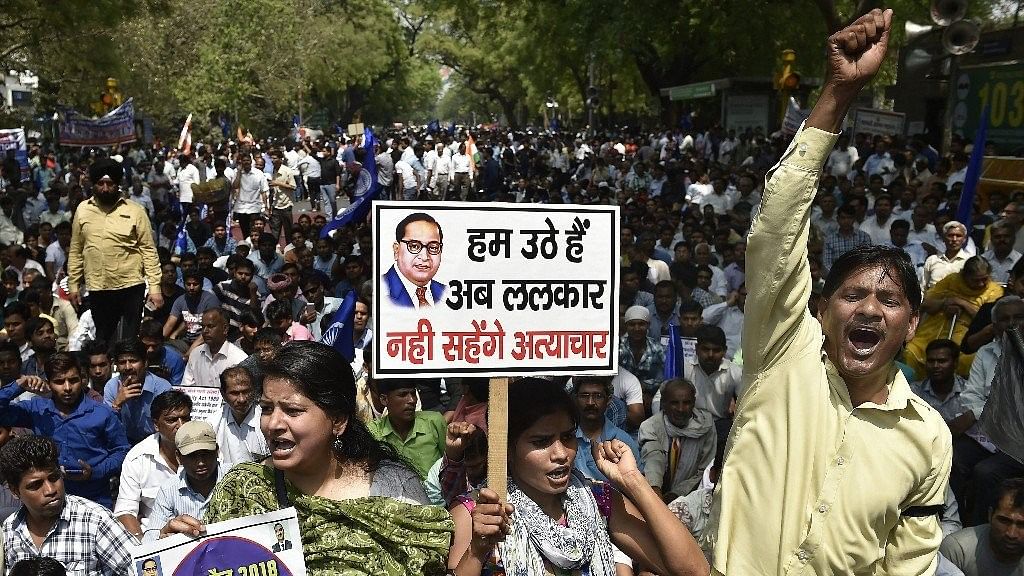 Members of the Dalit community raise slogans during Bharat Bandh against the alleged dilution of SC/ST Act in New Delhi, on 2 April 2018.