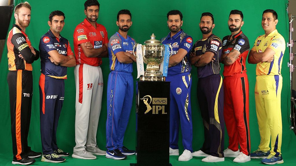 Captains pose with the 2018 IPL Trophy.